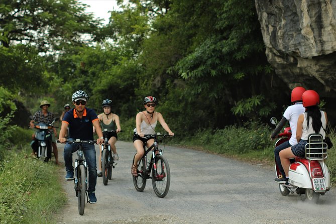 Discover Trang An Natural World Heritage, Bich Dong Pagoda, Cycling Day Tour - Cycling through rice fields near Tam Coc