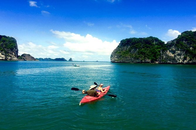 Full-Day Halong Bay Tour Including Kayaking from Hanoi - Boarding the junk boat at noon