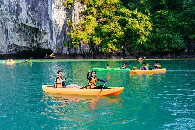 Halong bay Luxury Cruise Trip: Titop Island, Amazing Cave & Kayak - Lunch, sunset snacks, and the social side of the boat