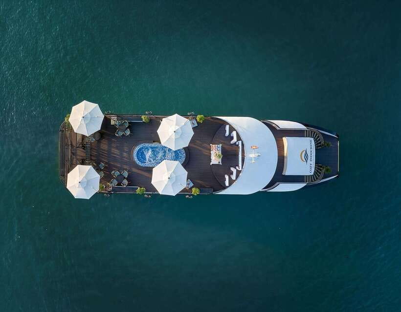 Halong Bay: Luxury Day Cruise with Buffet, Kayak, Swim - Boarding the boat and settling in for lunch