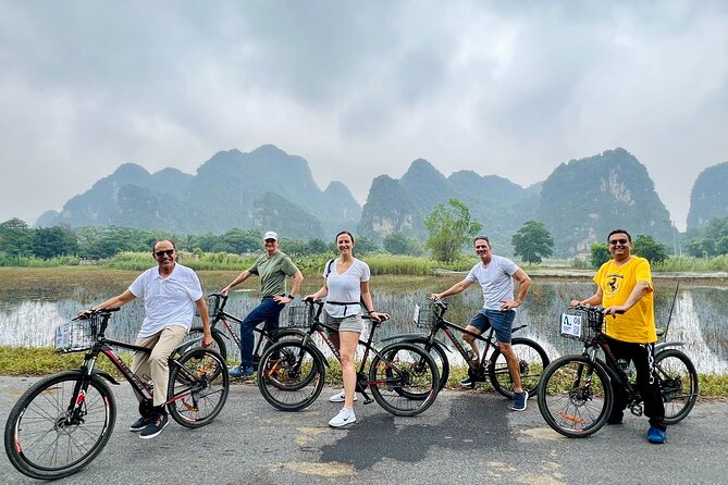 Hang Mua - Hoa Lu - Tam Coc Small Group Tour 8 People a Group - Climbing Hang Mua for the Tam Coc view