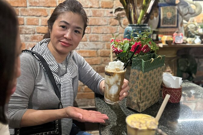 Hanoi Coffee Culture Tour: Sip, Taste & Hear Local Stories - Walking past the Hanoi Opera House