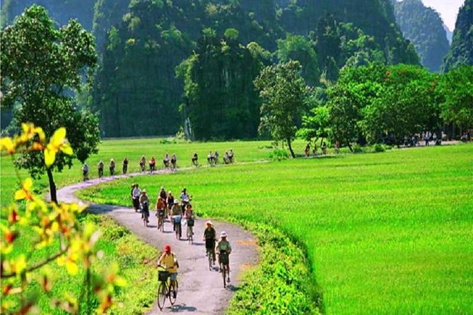Hanoi - Hoa Lu - Tam Coc - Mua Cave - 1 Day Tour. By Luxury Limousine From Hanoi - Climbing Mua Cave for the Tam Coc view