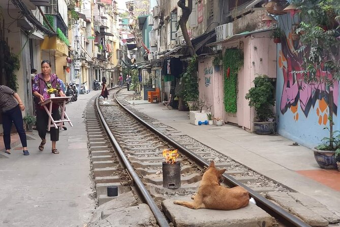 Hanoi Jeep Tour: Train-street, Highlights and Hidden Gems - Crossing Hanoi’s busy streets by open Jeep