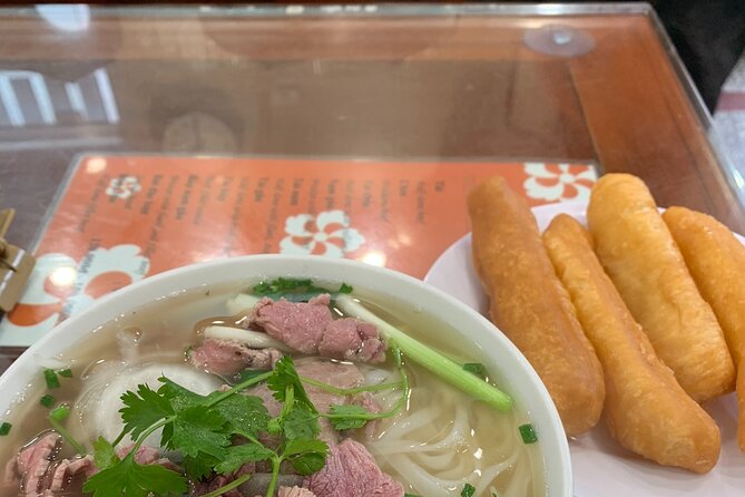 Hanoi Street Food Tour and Hang Out - A Hanoi food walk that begins with coffee and a lake crossing