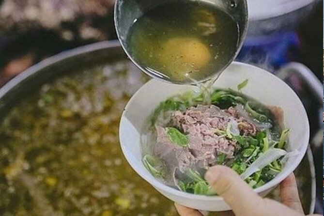 Hanoi Street Food tour by Scooter – Local Experience - A traditional market starts the evening