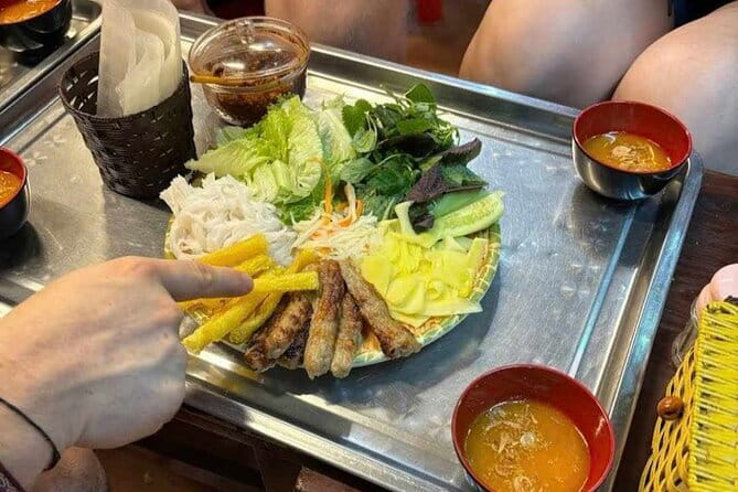 Hanoi Street Food Tour with egg coffee making - The first bowl: traditional pho at Chua Ly Trieu Quoc Su