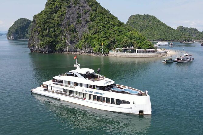 Hanoi to Ha Long Symphony Cruise with Limousine and Local Lunch - Titop Island, beach time, and the climb