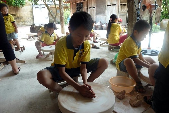Mix Bat Trang Ceramic Village And Real Hanoi Scooter Tour - A pagoda stop with a Buddhist focus