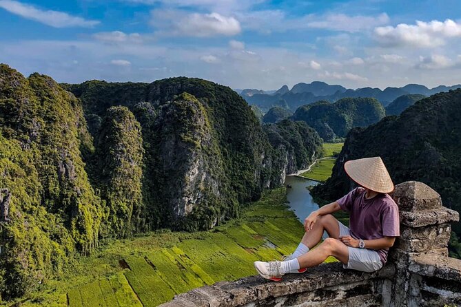 Ninh Binh 1 Day Tour(Tam Coc - Mua Cave - Bich Dong) - Climbing Mua Cave for the Ngoa Long Mountain view