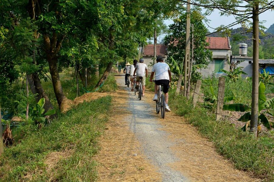 Ninh Binh Daily: Hoa Lu, Mua Cave, Tam Coc, Bike & Swimming - Sunset tea, fresh fruit, and swimming