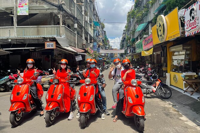 Vespa Female Ao Dai riders Night Street Food + See Train Street - A four-hour food ride through Hanoi after dark